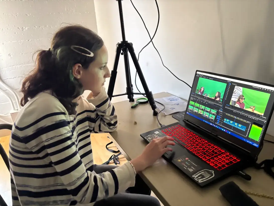 A teen editor cutting her crew’s green-screen footage on a real timeline