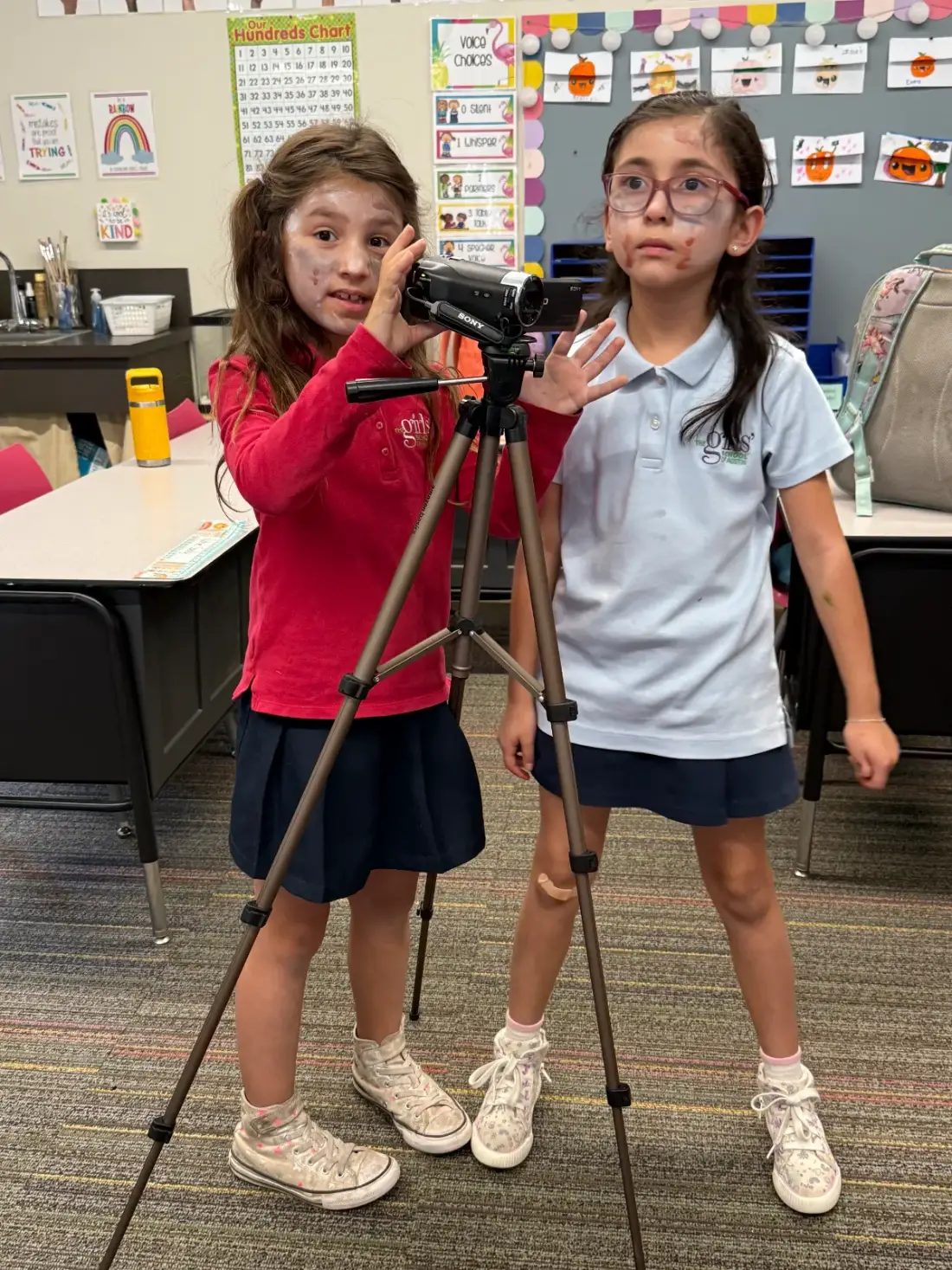 Two campers in make-up effects shooting a scene