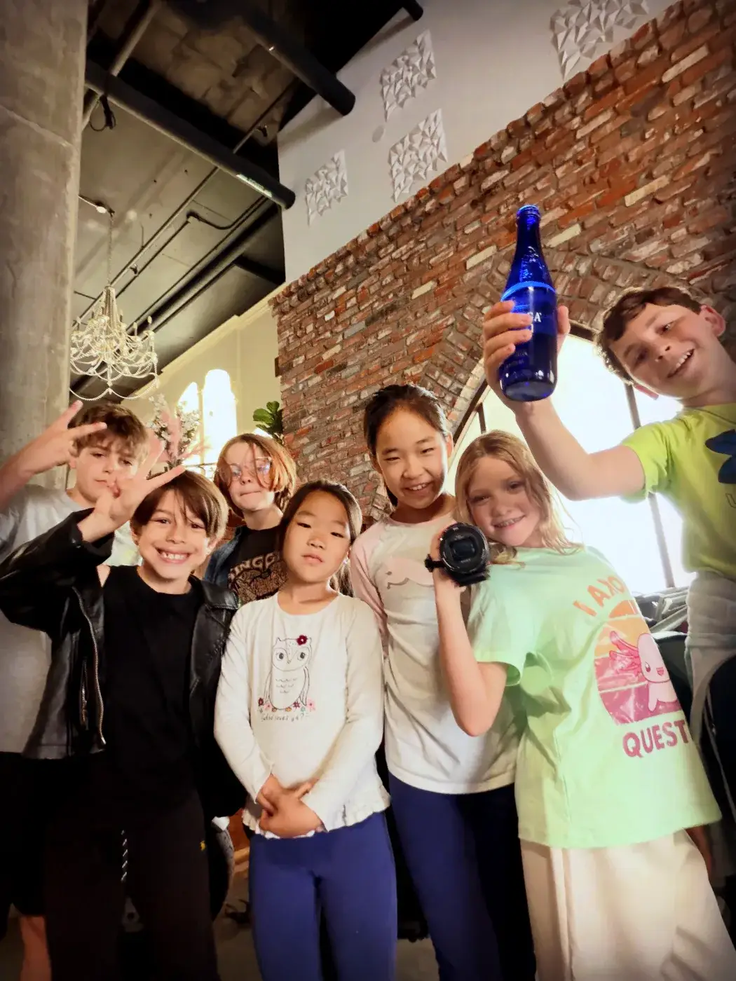 A Sunday class crowding the lens for a crew photo, camera in hand