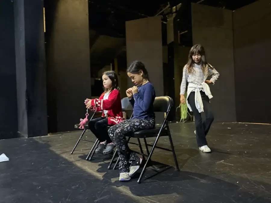 Campers blocking a scene on a black-box stage