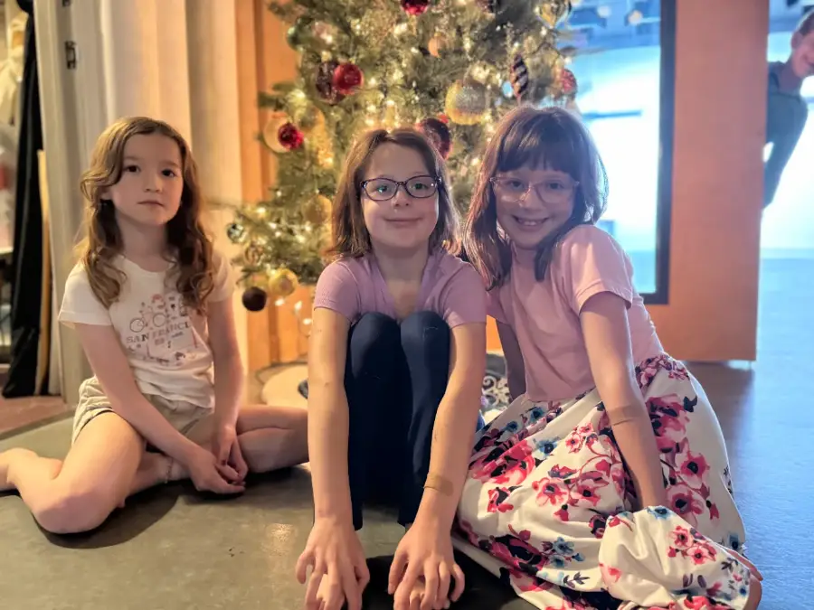 Three campers between takes at a holiday session